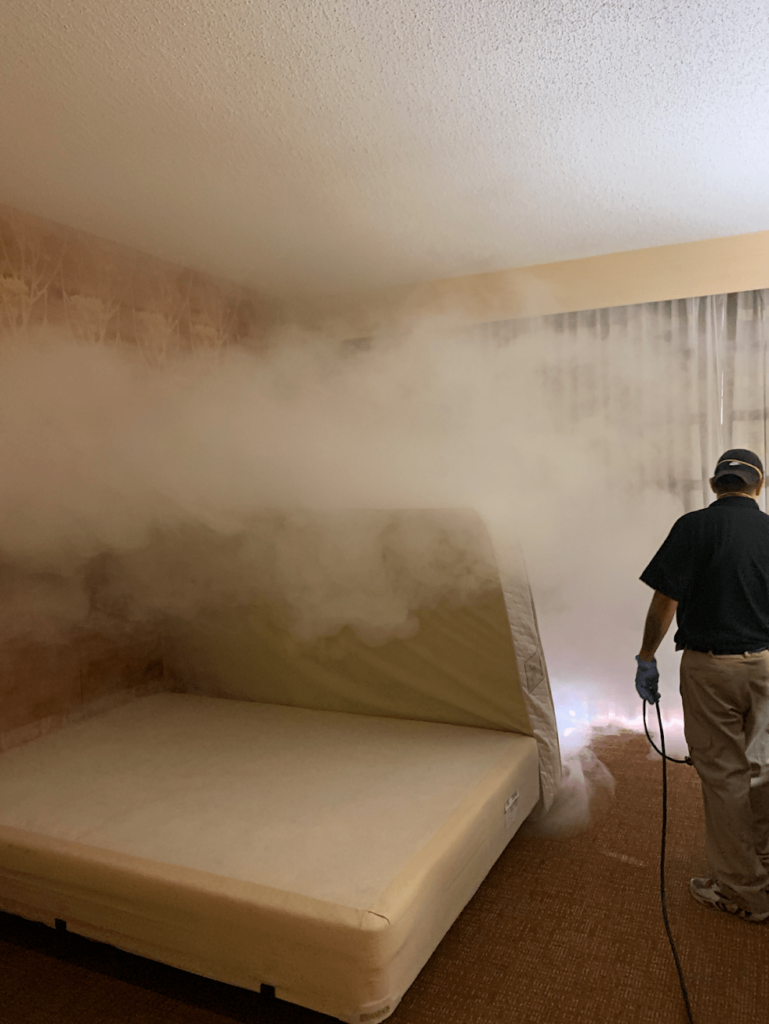 Renue technician applying proprietary Odar removal process in a smoking room.